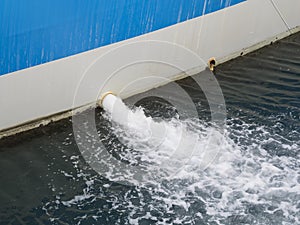 Bilge water pumped out of the side of a ship