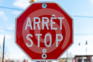 Bilingual stop sign in French and English photo