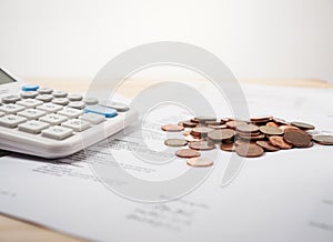 Bill of medication with calculator and coins