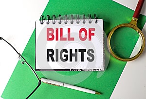 BILL OF RIGHTS text on notebook on green paper