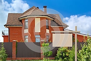 Billboard on background of the house