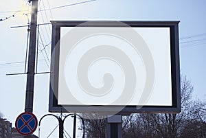 A billboard in the daytime on the street