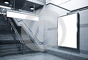 Billboard and direction signage mock up in subway with stairs photo