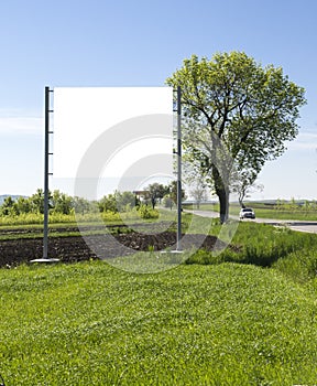 Billboard on green field