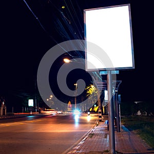 Billboards at side road in night photo