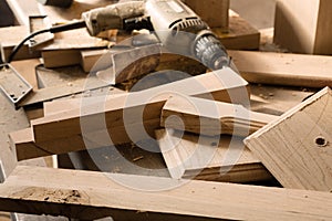 Billets of wood for furniture lie on a workbench photo