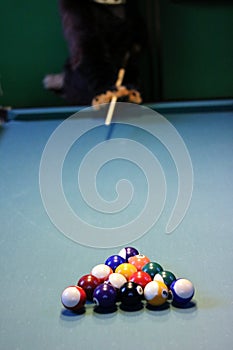 billiard ball on table with green and blue cloth in billiards club