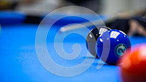 Billiard balls in a blue pool table