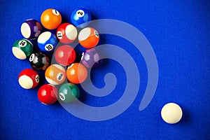 Billiard balls in a blue pool table.