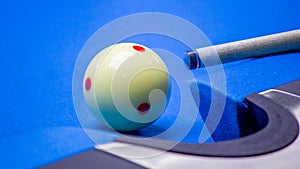 Billiard balls in a blue pool table