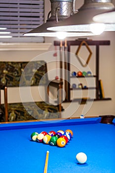 Billiard balls on a blue table.