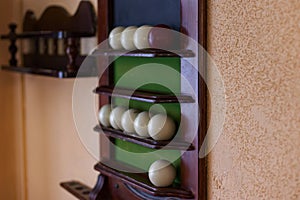 Billiard balls on a Board on the wall