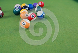 Billiard balls on a green billiard table