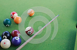 Billiard balls on a green billiard table