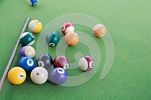 Billiard balls on a green billiard table