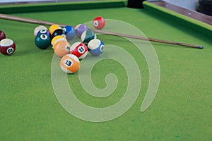 Billiard balls on a green billiard table