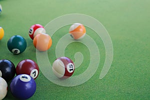 Billiard balls on a green billiard table