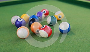 Billiard balls on a green billiard table