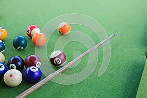 Billiard balls on a green billiard table