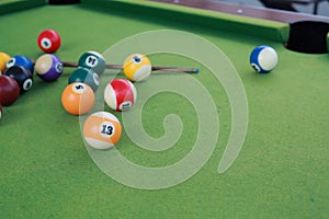 Billiard balls on a green billiard table