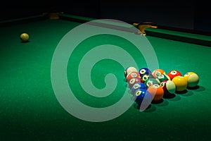 Billiard balls on green billiards table