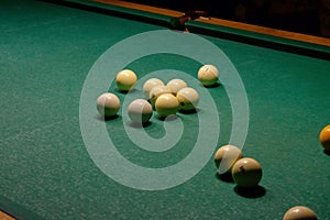 Billiard balls on a green pool table