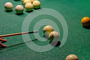 Billiard balls on a green pool table