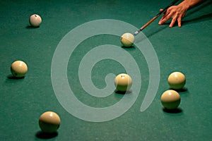 Billiard balls on a green pool table