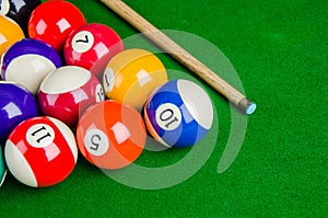 Billiard balls on green table with billiard cue, Snooker,