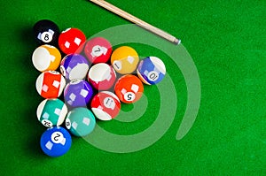 Billiard balls on green table with billiard cue, Snooker,