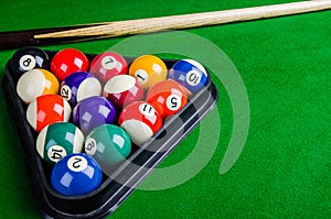Billiard balls on green table with billiard cue, Snooker, Pool.