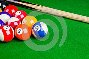 Billiard balls on green table with billiard cue, Snooker, Pool.