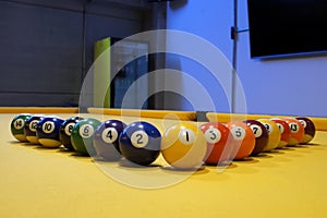 Billiard balls, odd on one side and even on the other.