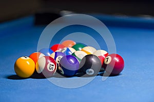 Billiard balls on pool blue table - sport background