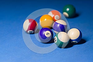 Billiard balls on pool blue table - sport background