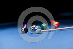 Billiard balls on pool blue table - sport background