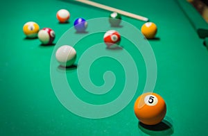 Billiard balls on pool green table