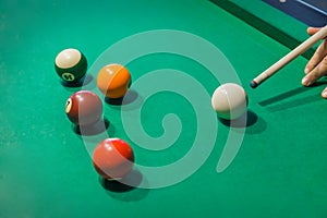 Billiard balls on pool green table