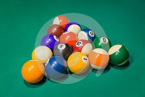 Billiard balls on pool green table