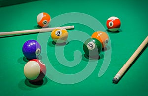 Billiard balls on pool green table