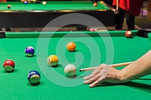 Billiard balls on pool green table