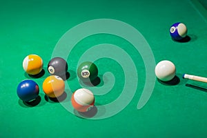 Billiard balls on pool green table