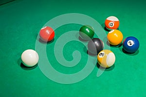 Billiard balls on pool green table