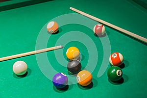 Billiard balls on pool green table