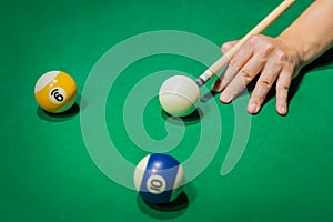 Billiard balls on pool green table