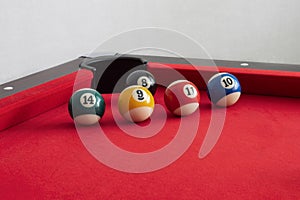 Billiard balls on a pool table