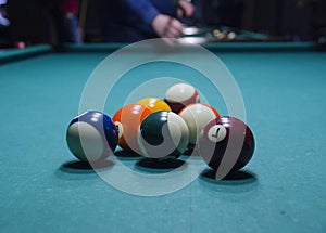 Billiard balls on a pool table