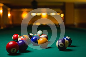 Billiard balls in a pool table.