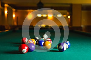 Billiard balls in a pool table.