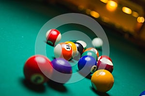 Billiard balls in a pool table.